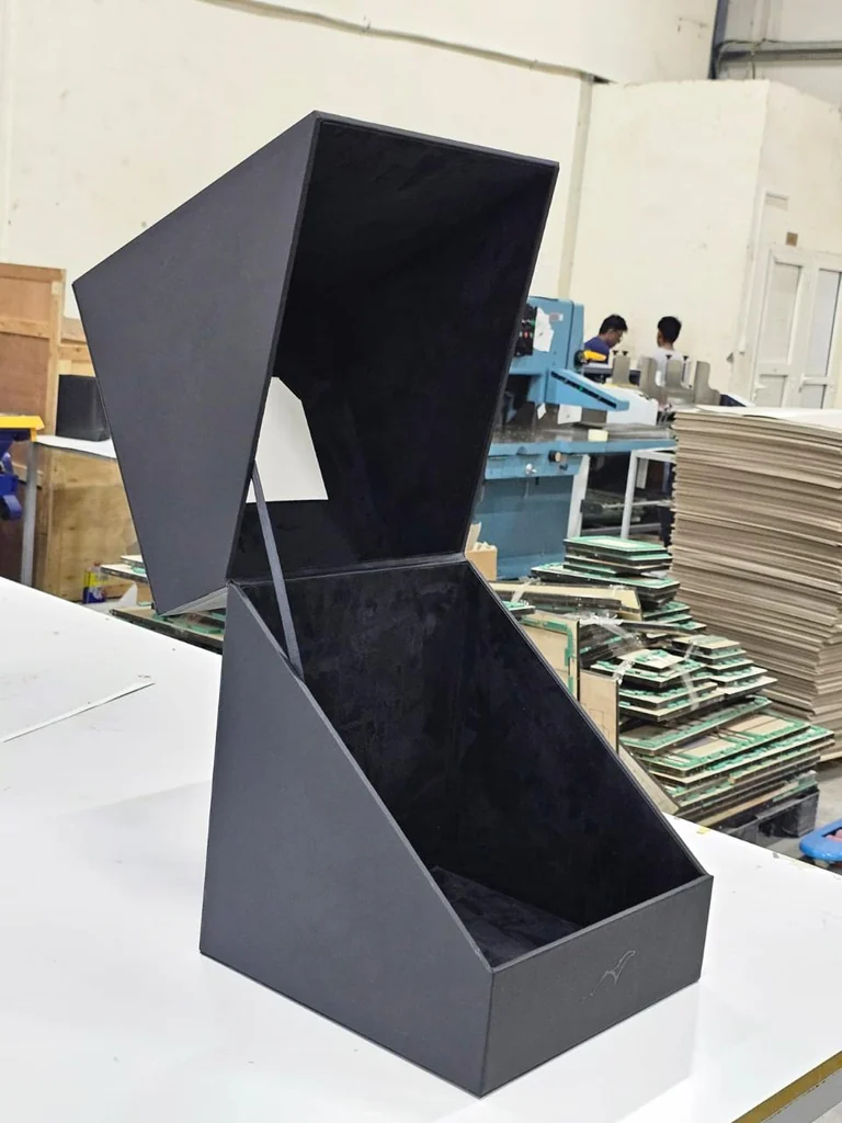 Wrapped cover material applied to a hardboard shell